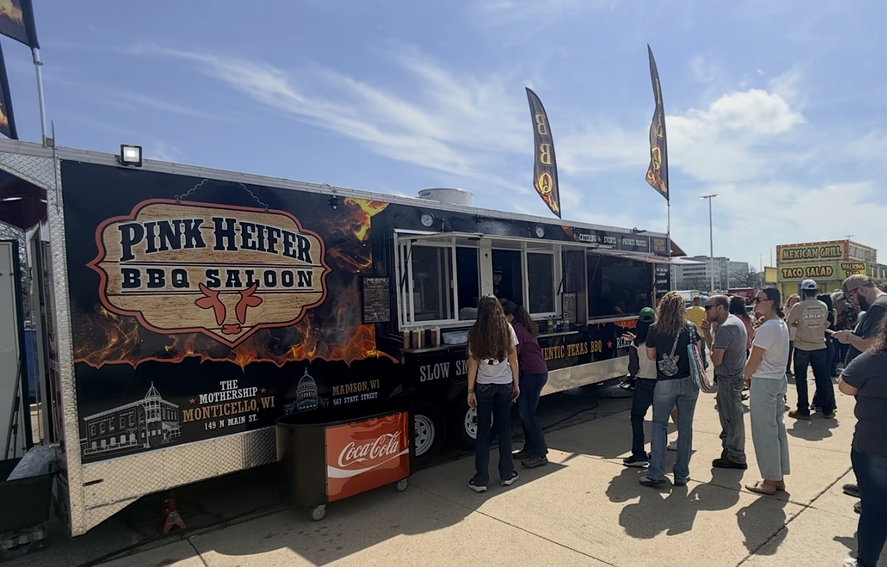 Pink Heifer BBQ Saloon StageCoach One food trailer serving guests at an event